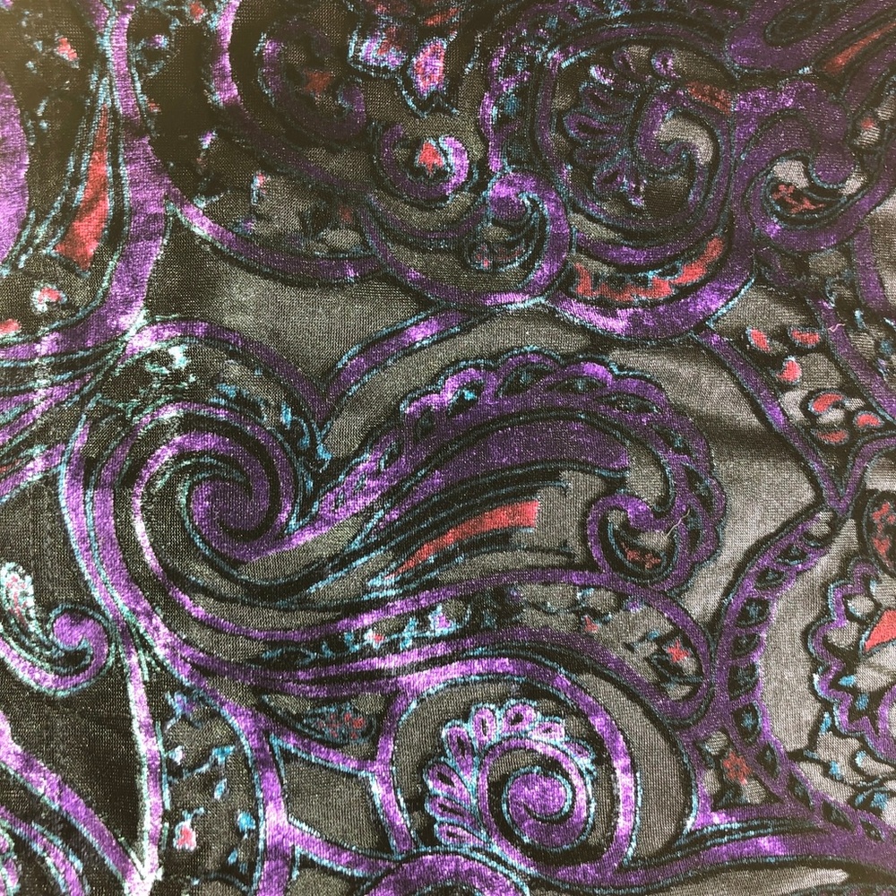 Child's blouse:  bright shiny purples, blacks